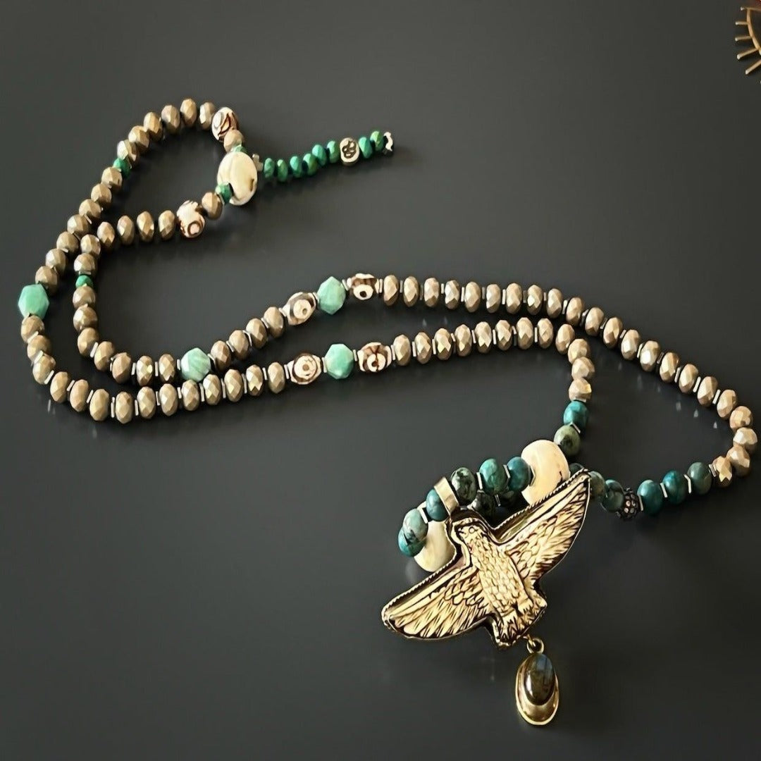 Bold and Powerful Eagle Necklace - Handmade with sparkly crystal beads, African turquoise, evil eye beads, and a hand-carved eagle pendant symbolizing leadership and vision.