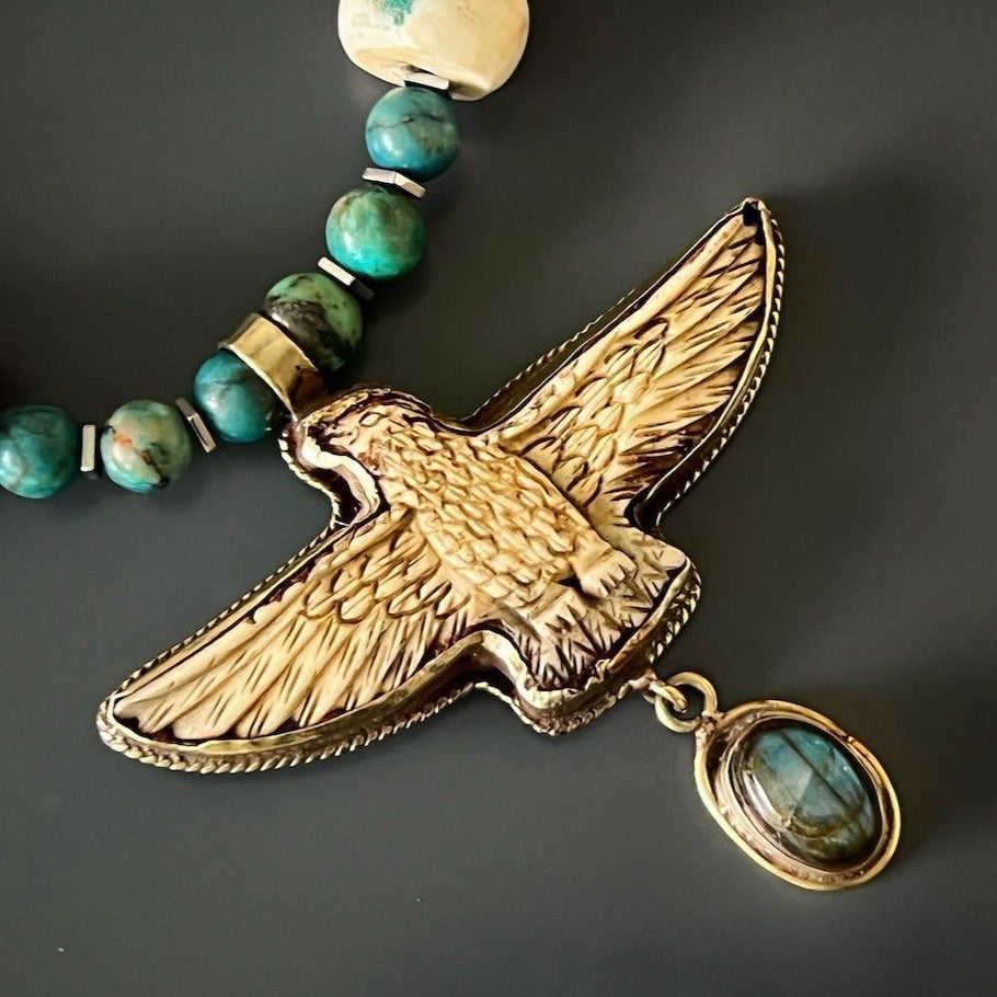 Eagle Pendant Necklace - Handmade accessory with labradorite stone, crystal beads, and an eagle pendant, representing leadership and rebirth.
