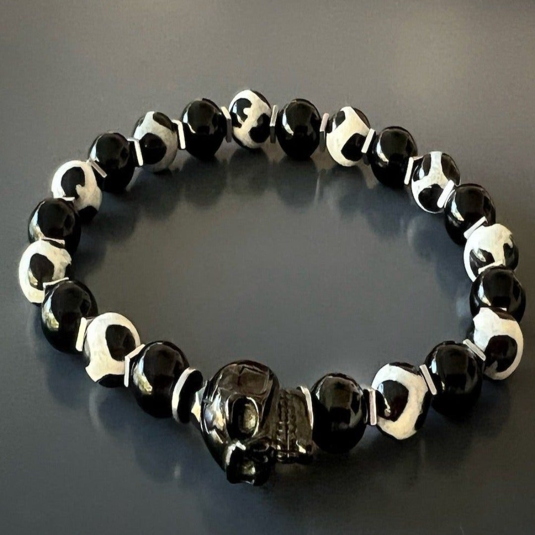 Unique Skull Bracelet - Striking bracelet made with Black Onyx stone, Nepal agate beads, and a steel skull accent, perfect for those who embrace risk and adventure.