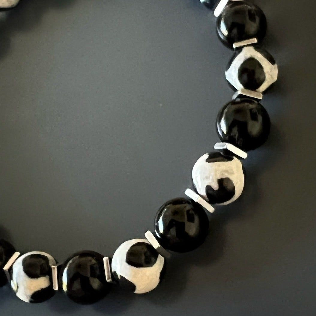 Skull and Stone Bracelet - Stylish accessory crafted with Black Onyx, Nepal agate beads, and a black steel skull accent, symbolizing creativity and emotional healing.