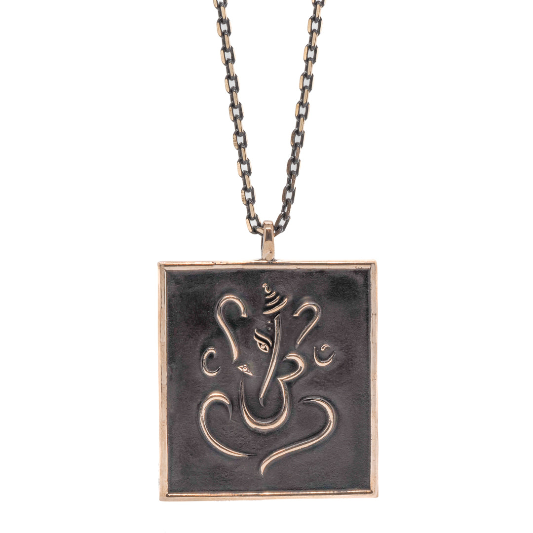 The Ganesha Necklace is a beautiful and unique piece of jewelry that features a bronze handmade pendant of the beloved Hindu deity Ganesha.