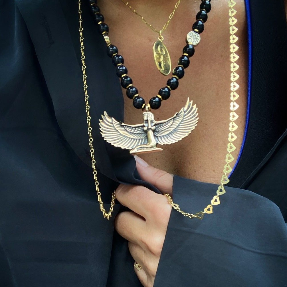 Model Wearing the Egyptian Goddess Isis Necklace, showcasing its beauty and elegance as a statement accessory.