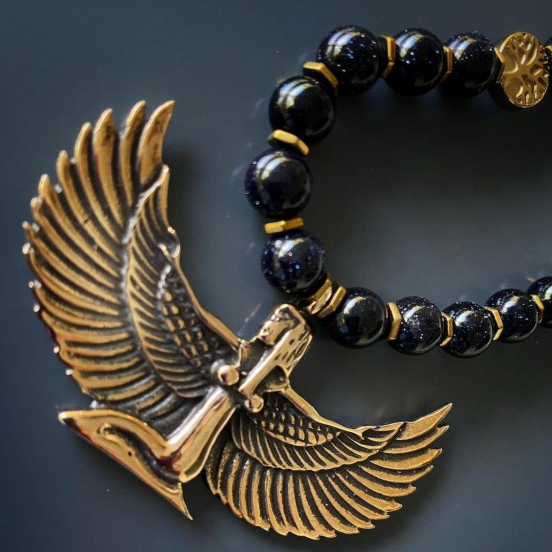 Striking Egyptian Goddess Isis Necklace with Sand Star Stone Beads and Bronze Pendant, an embodiment of feminine power.