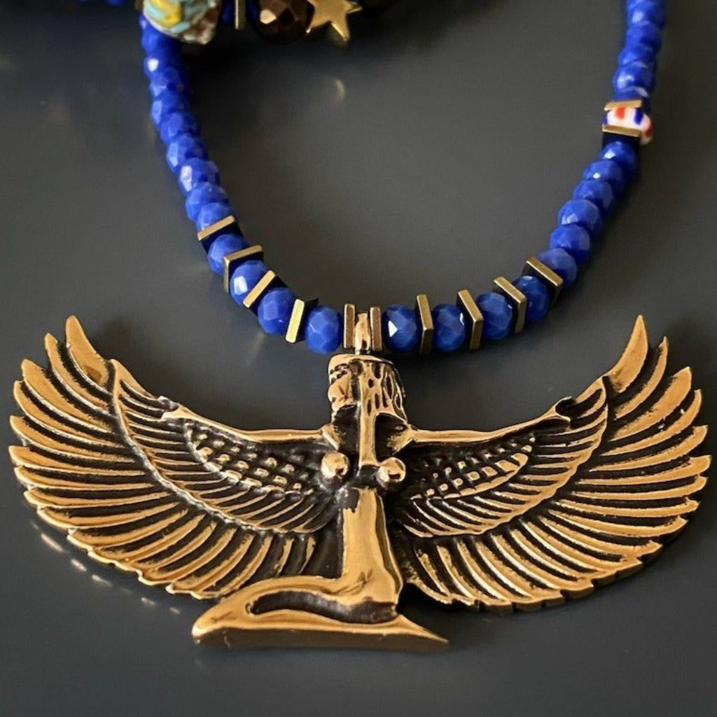 Elegant Goddess Isis Necklace with gold hematite spacers and a bronze dream symbol charm, a unique and meaningful accessory.