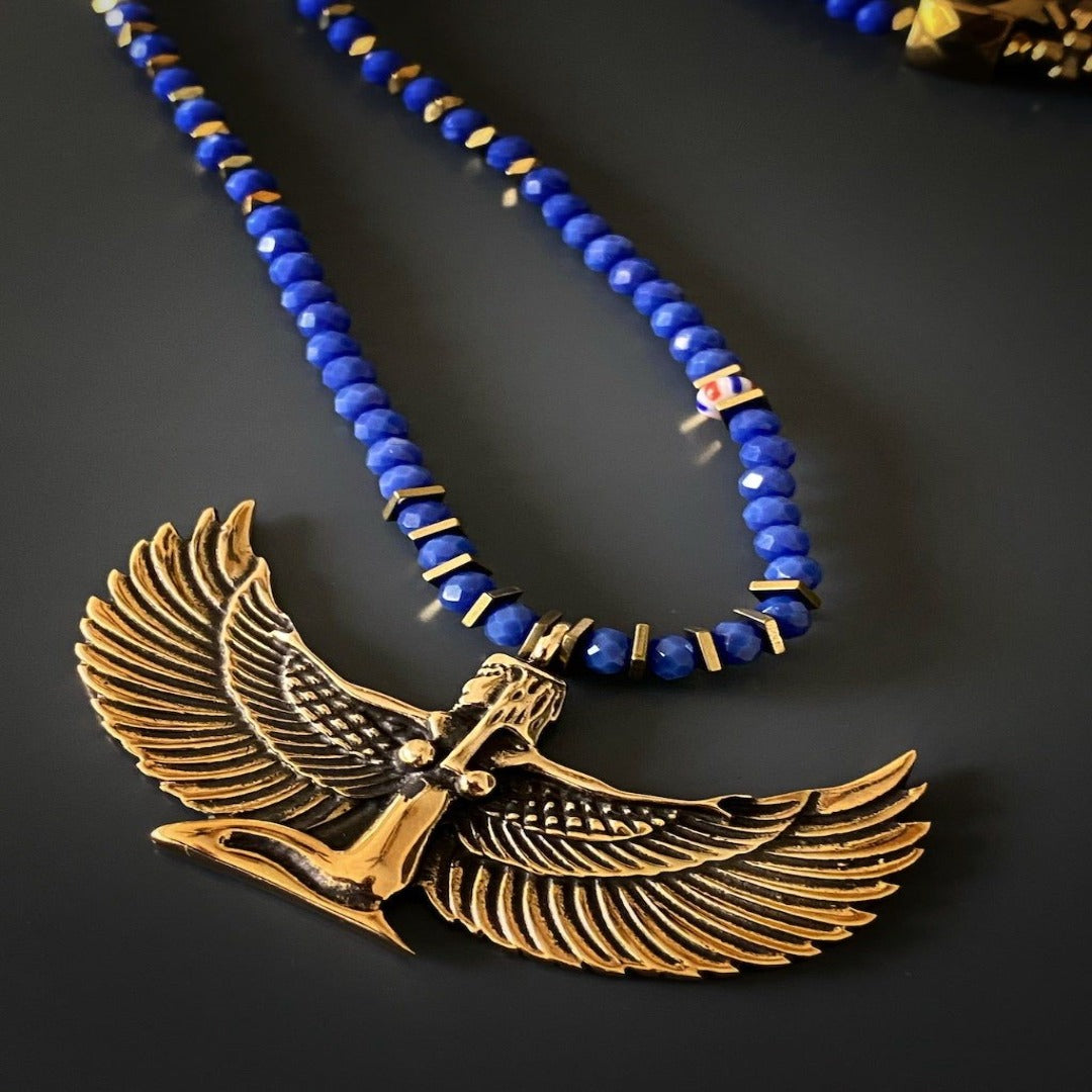 Goddess Isis Healing Necklace - Unique and meaningful necklace featuring a bronze pendant of the Goddess Isis, believed to possess healing abilities and the power to shape destiny, complemented by blue crystal beads and gold hematite stones.