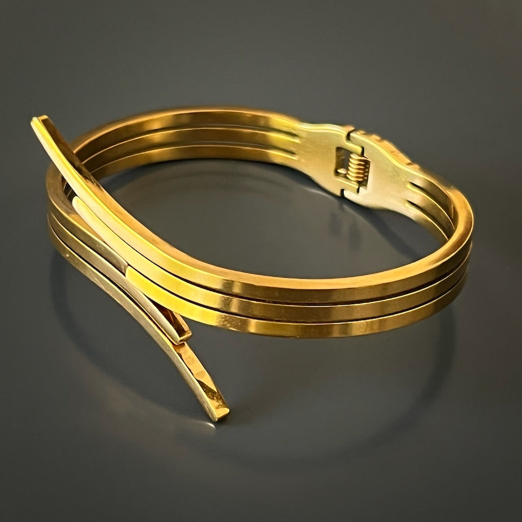 Handcrafted Gold Bangle Bracelet - A stylish image showcasing the craftsmanship of the handmade bracelet, made with attention to detail and featuring a sleek design. This accessory is a perfect addition to your jewelry collection.