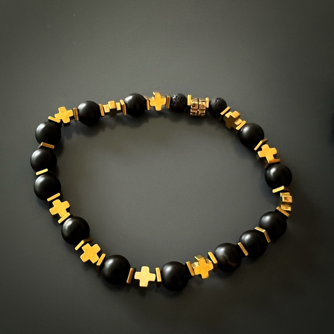 Gold Cross Bracelet Set - A stunning image showcasing the Gold Cross Bracelet Set, featuring Black Onyx Stone beads, Lava rock stone beads, bronze accent beads, and a gold color cross hematite bead. The combination of materials and colors creates a fashionable and meaningful accessory for both men and women.
