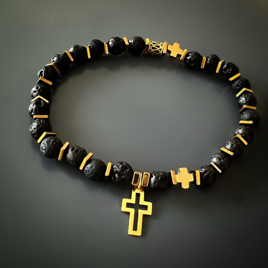 Gold Cross Bracelet Set - A detailed image highlighting the intricate craftsmanship of the Gold Cross Bracelet Set. The combination of matte Black Onyx Stone beads, Lava rock stone beads, and gold accents makes this handmade set a meaningful and fashionable accessory.