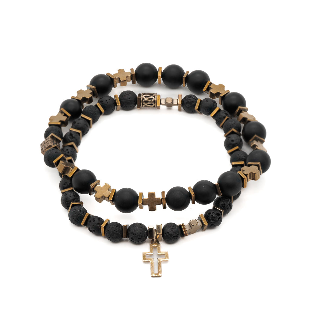 Gold Cross Bracelet Set - A set of two bracelets featuring 8mm matte Black Onyx Stone beads, 6mm Lava rock stone beads, bronze accent beads, gold color cross hematite beads, and gold color hematite spacers. The 925 Sterling silver on 18k gold plated cross charm adds a touch of elegance to this handmade bracelet set.