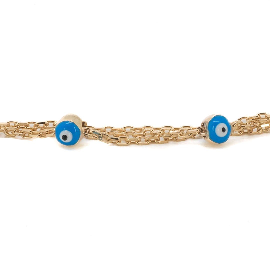 Gold Enamel Evil Eye Bracelet - A captivating photograph of the Gold Evil Eye Triple Bracelet.