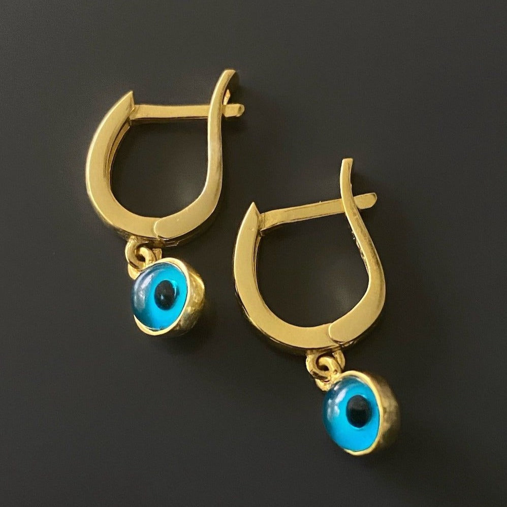 Stylish Gold Huggie Hoops - A fashionable photograph highlighting the stylish design of the Gold Huggie Hoop Earrings.