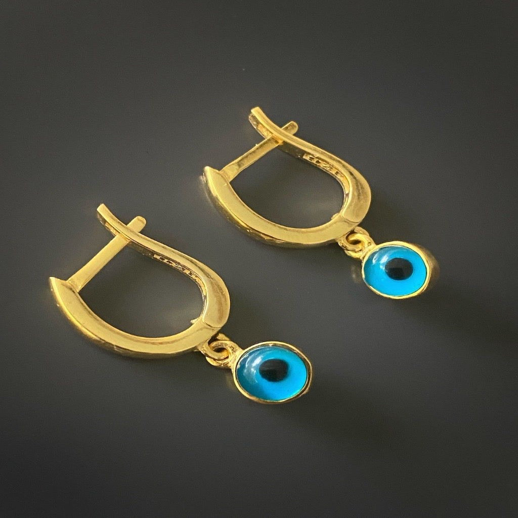 Minimalist Huggie Hoop Earrings - A chic and minimalist display of the Gold Huggie Hoop Earrings.