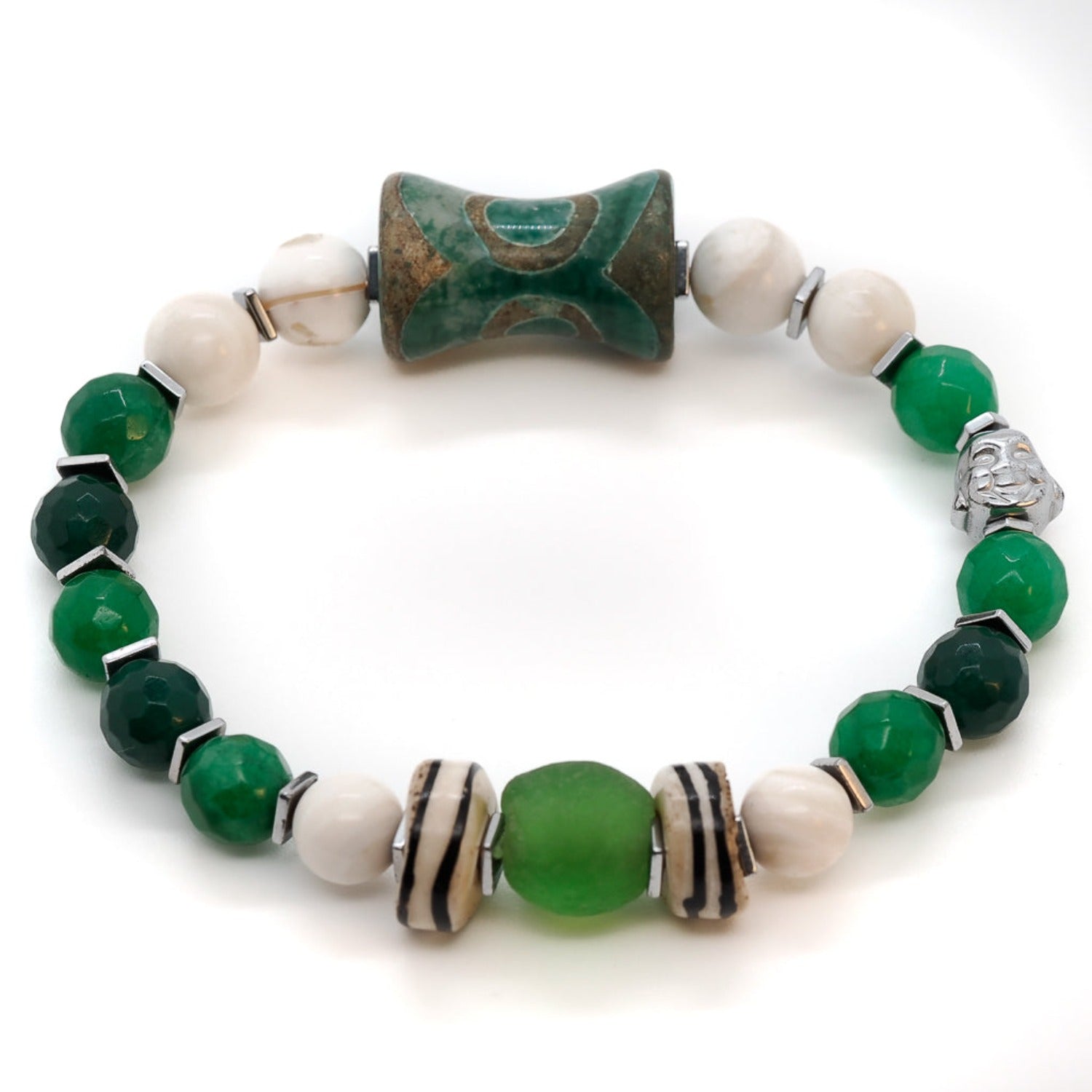 The Green Buddha Bracelet beautifully crafted with a silver color Hematite stone Buddha bead, Handmade Nepal Green bead, and African green glass bead, representing mindfulness and spiritual well-being.
