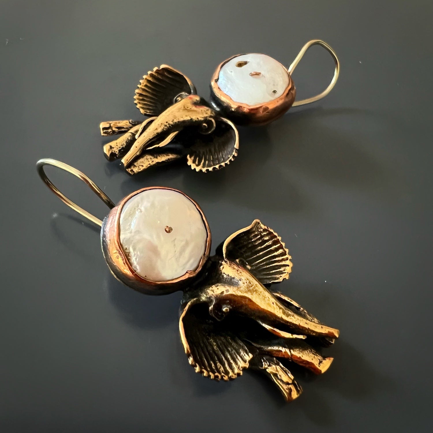 the Handmade Unique Spirit Elephant Earrings, showcasing how they beautifully frame the face and add a touch of elegance and character to any outfit.