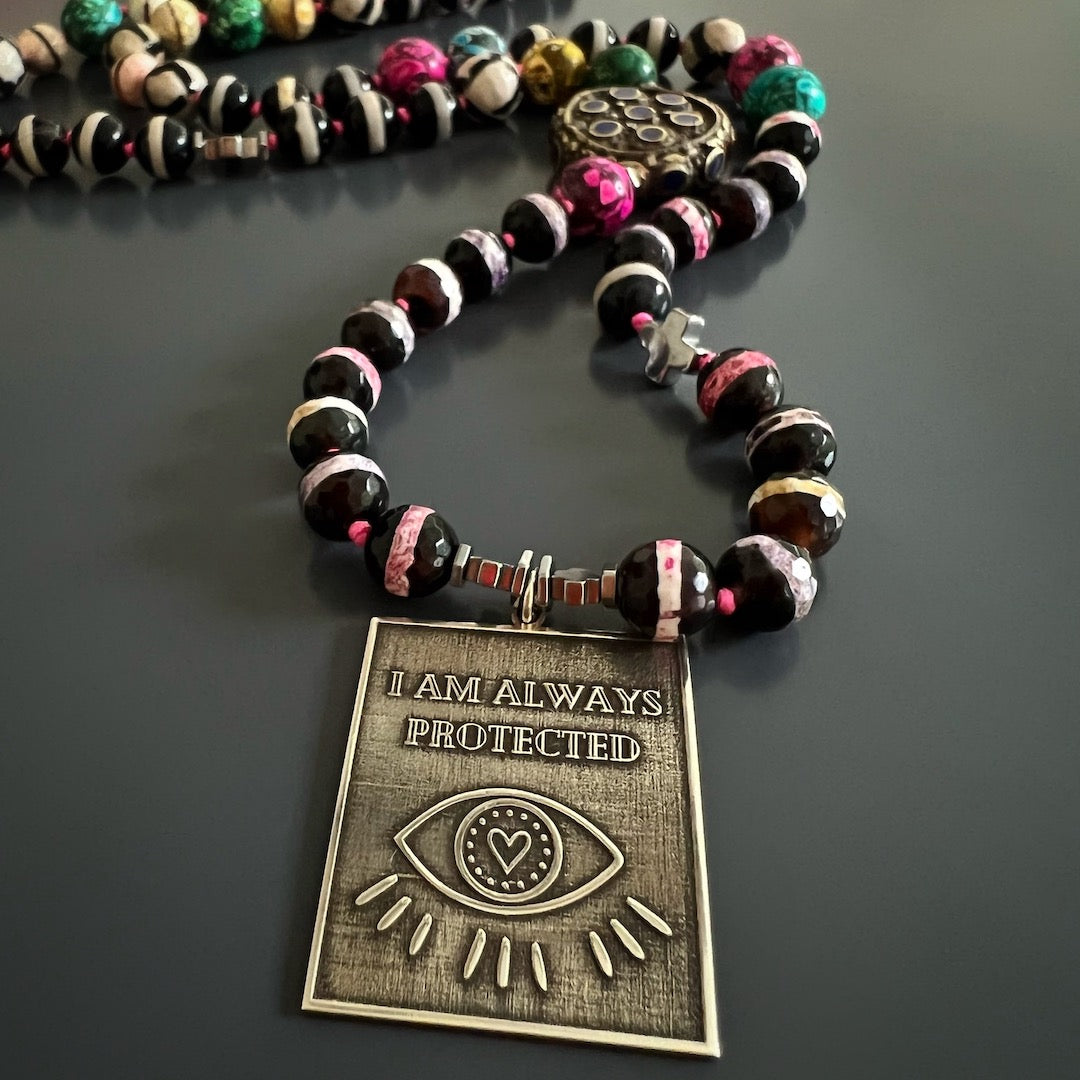 Wear the I Am Always Protected Necklace for a lifetime of fortune and protection, as showcased in this image.