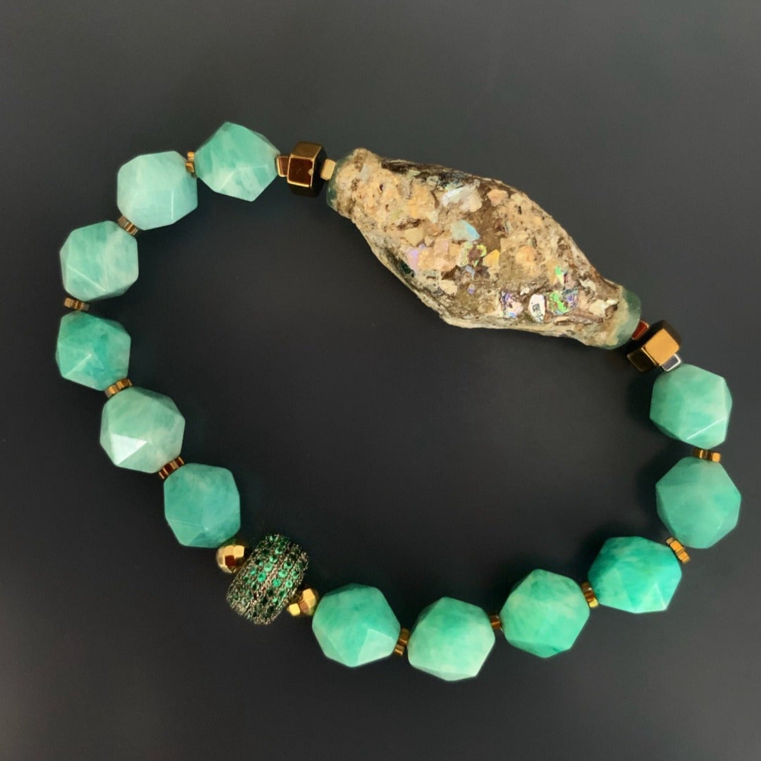 Adorn your wrist with the Historical Bracelet, showcasing the beauty of larimar and the historical multicolor glass bead.