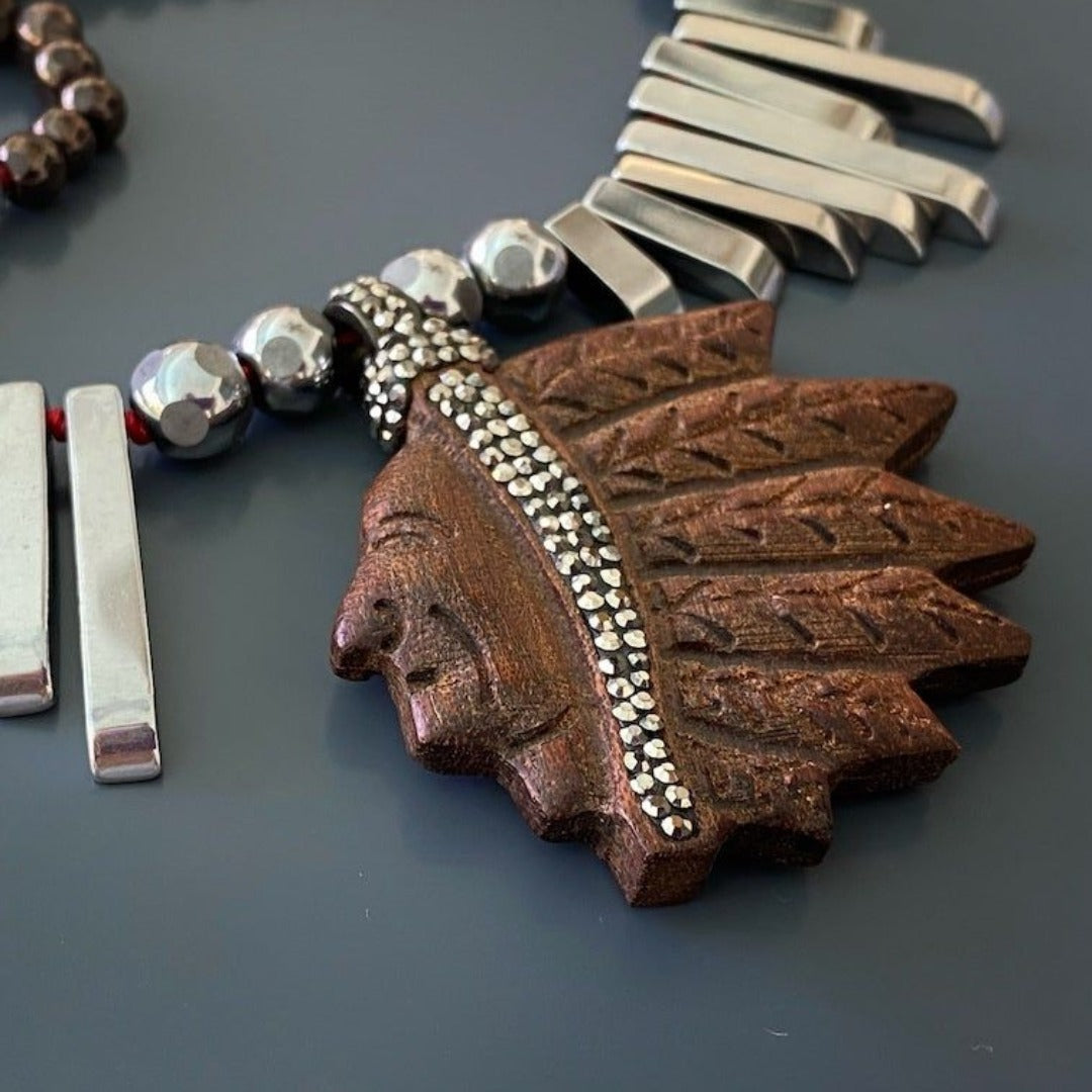 Indian Unique Necklace showcasing the engraved wood Indian chief pendant and sparkling Swarovski crystals.