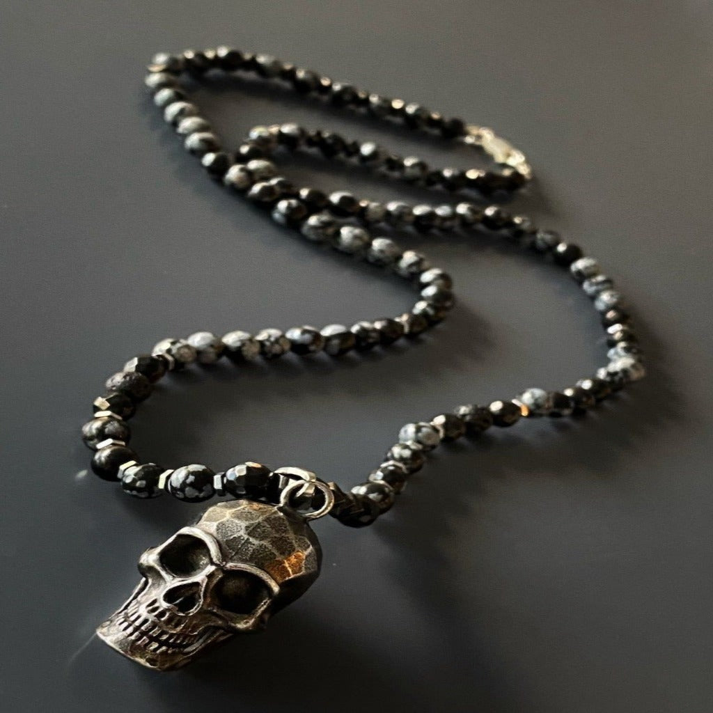 The Inner Power Skull Necklace showcasing the powerful Hematite and Obsidian Snowflake stone beads with a detailed Steel Skull Pendant.