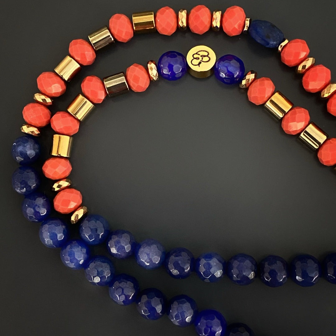 Immerse yourself in the symbolism of the Lotus Flower Mandala Necklace, adorned with Lapis Lazuli and Blue Agate beads, representing purity, enlightenment, and serenity.