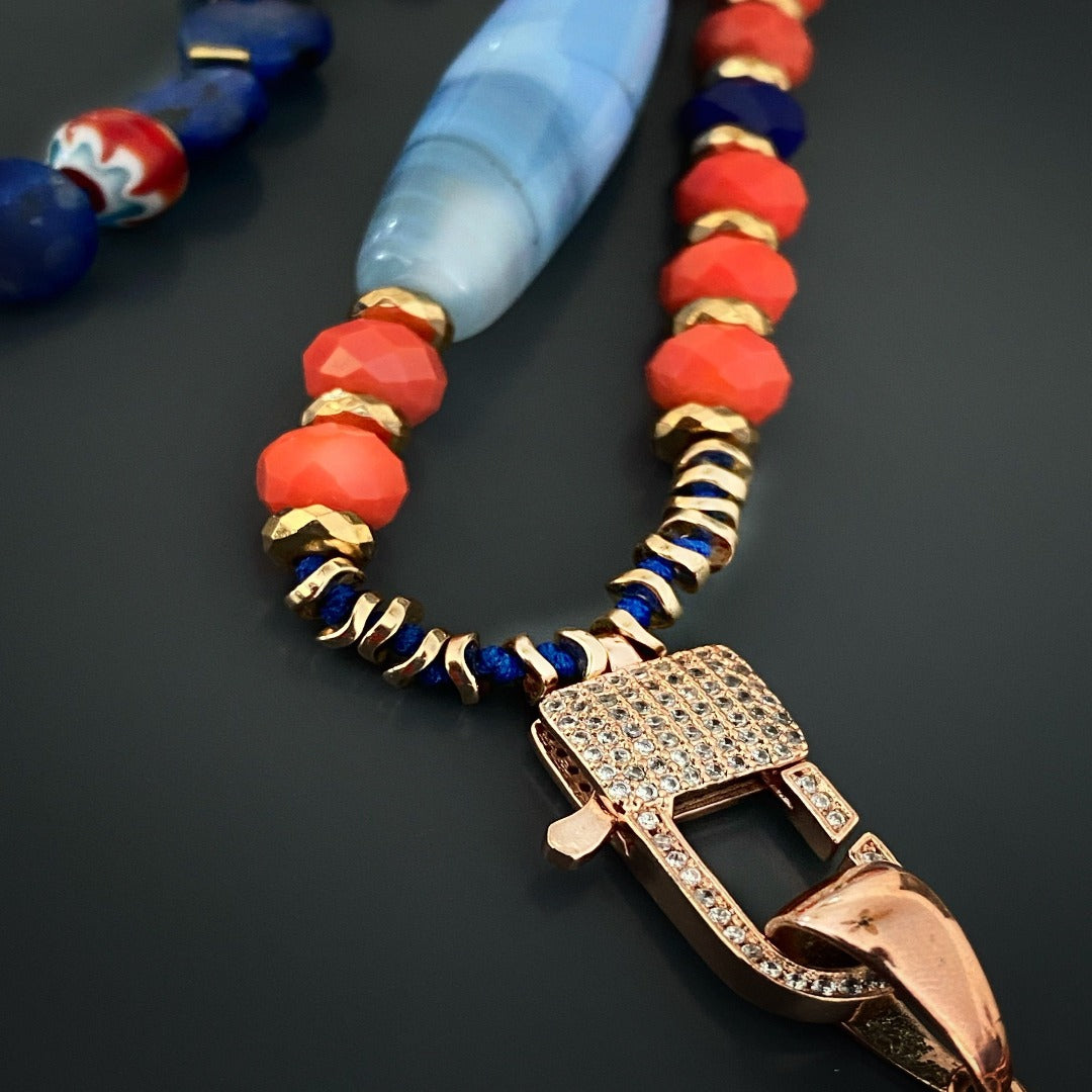 Awaken your spiritual connection with the Lotus Flower Mandala Necklace, handcrafted with Lapis Lazuli and Blue Agate beads, bringing balance and tranquility to your journey.
