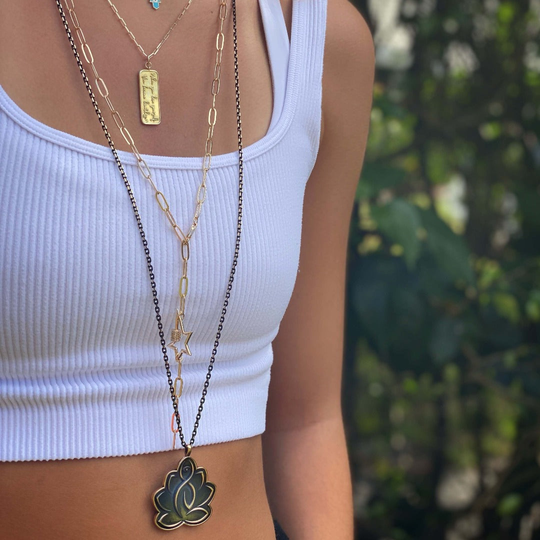 See how the Lotus Flower Protective Hope Necklace beautifully complements any outfit, as worn by our model, radiating confidence and spirituality.