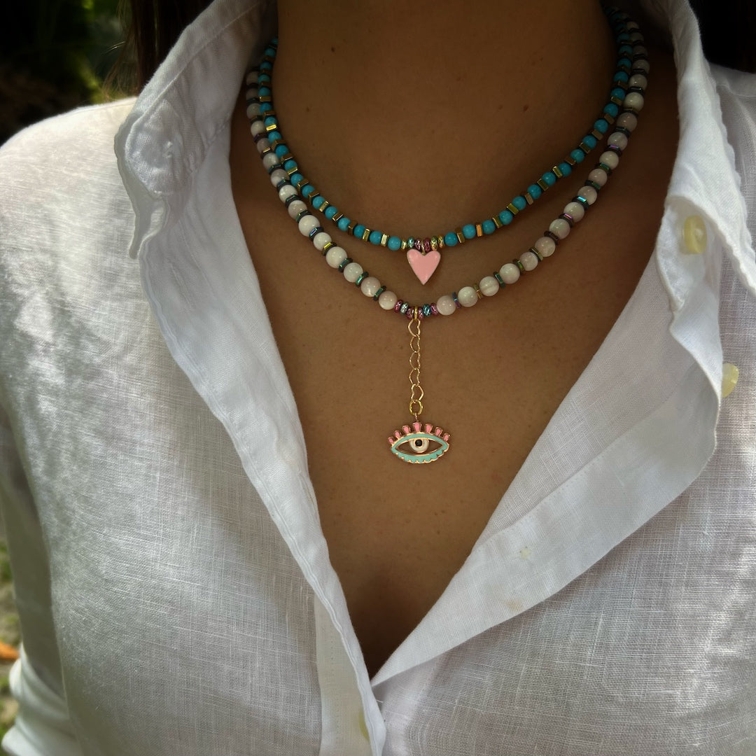 See how the Love Protection Necklace beautifully adorns our model, radiating elegance and spiritual energy.