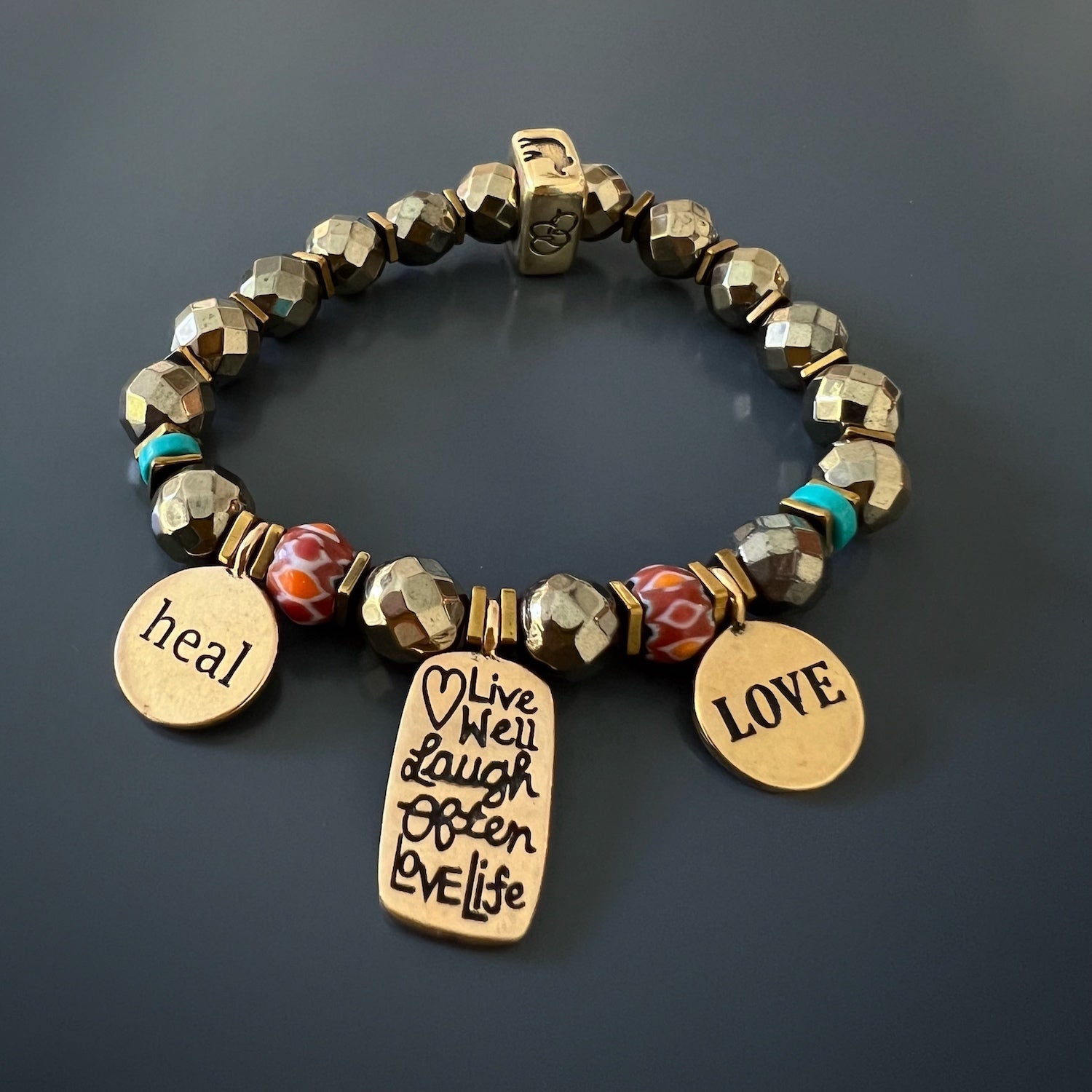 Discover the beauty and symbolism of the "Love Your Life" Bracelet, handcrafted with love and adorned with inspiring charms.