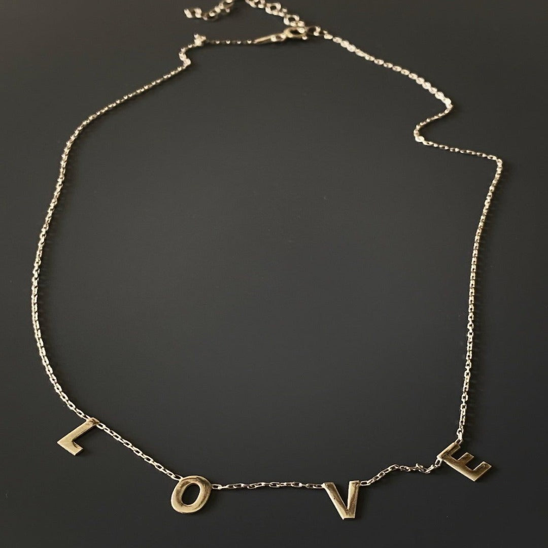 Embrace the timeless beauty of the Love Necklace, handcrafted with care and attention to detail for a truly unique piece of jewelry.