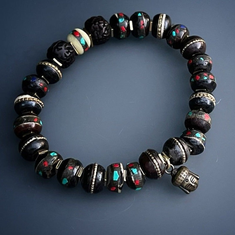 Immerse yourself in the mystic design of the Meditation Bracelet, showcasing Nepal seed beads, hematite spacers, and a bronze Buddha charm.
