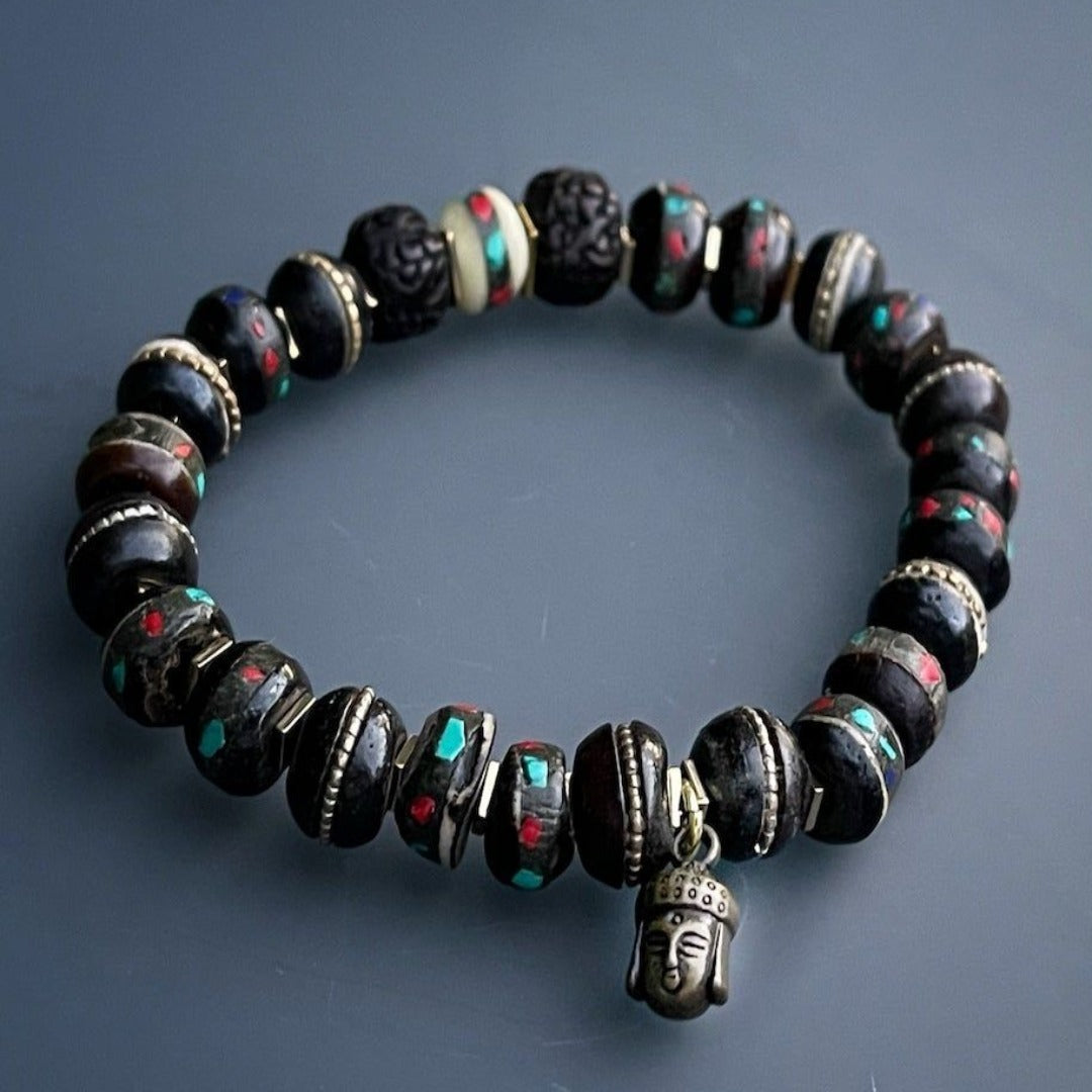 Unleash your inner peace with the Meditation Bracelet, featuring a harmonious blend of Nepal yak bone beads, seed beads, and a serene Buddha charm.