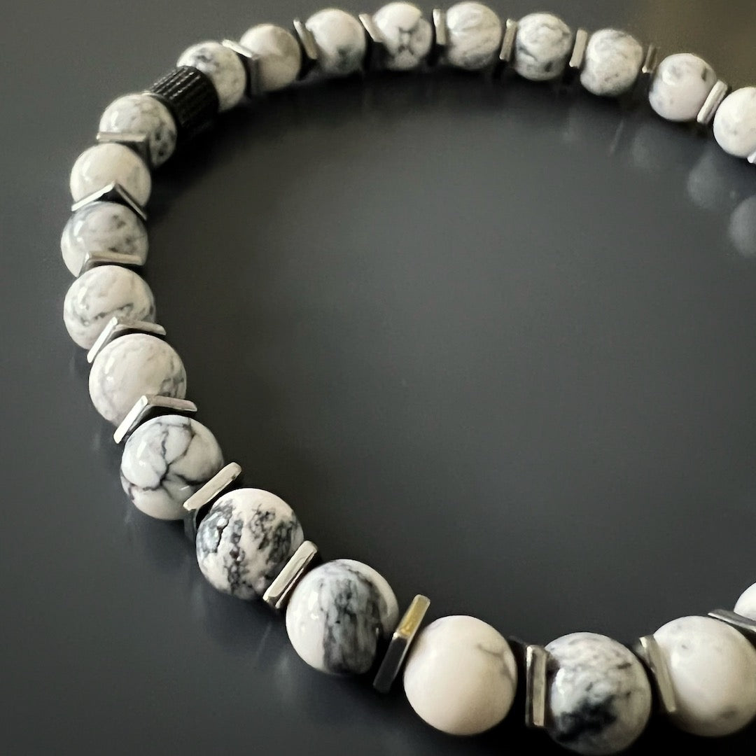 Unveil your spiritual side with the Men&#39;s Spiritual Beaded Skull Bracelet, crafted with White Howlite stones and a Sterling Silver skull charm.