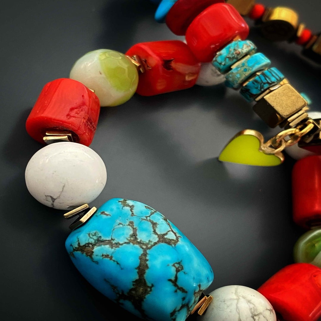 Handmade bracelet with turquoise stone, white howlite beads, and orange coral beads.