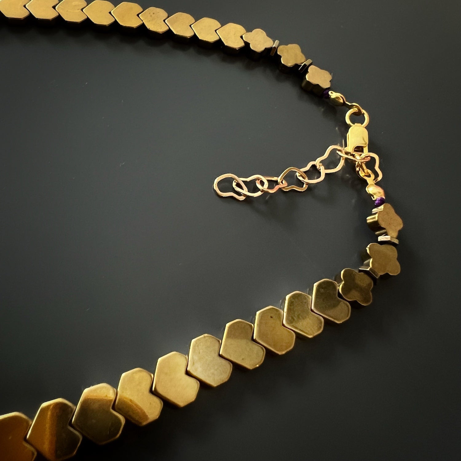 Stunning blue heart necklace with gold color hematite beads for a pop of color and personality