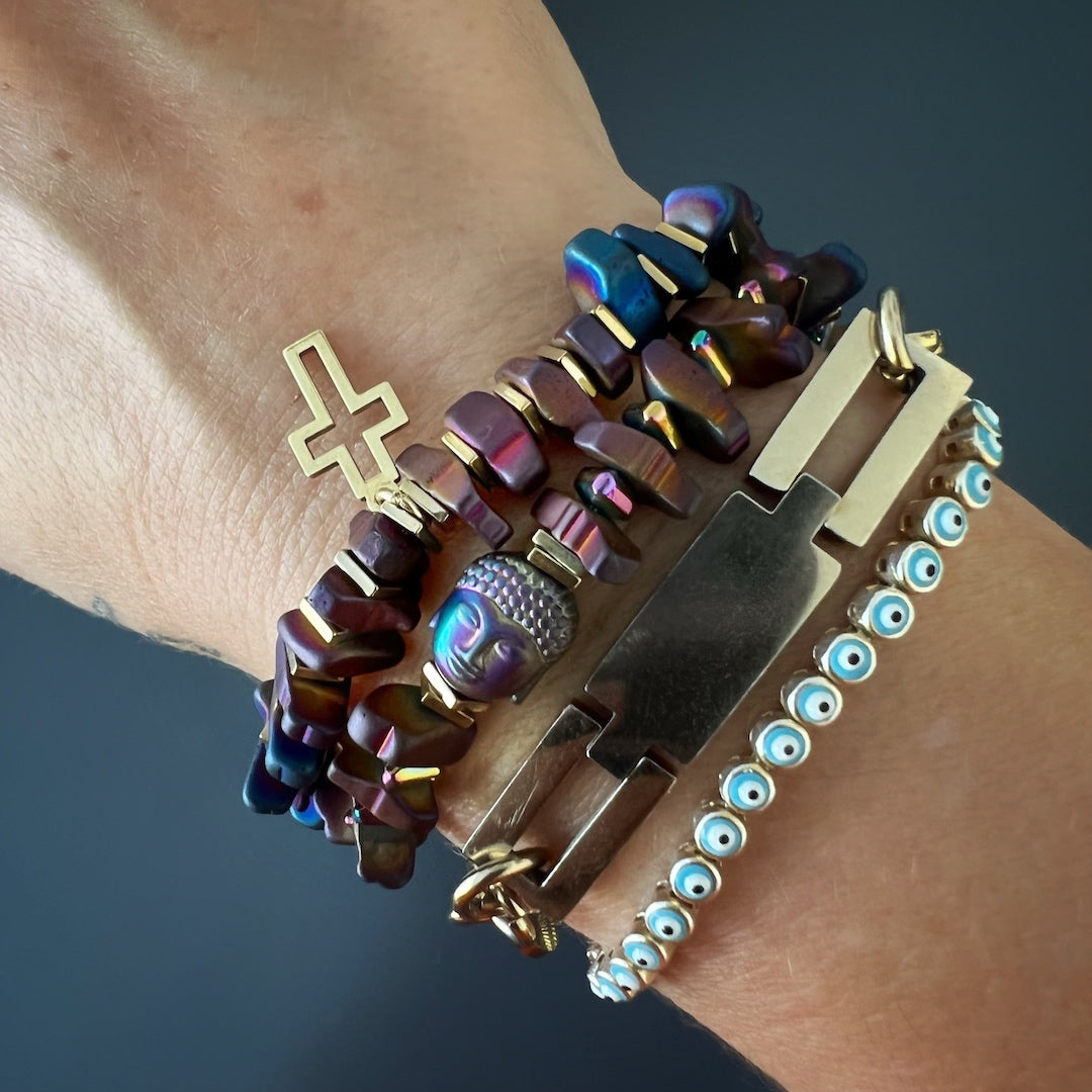 The model embraces the spiritual energy of the Mystic Buddha Bracelet, as she wears it with confidence, allowing the Hematite Buddha bead to symbolize tranquility and enlightenment in her daily life.