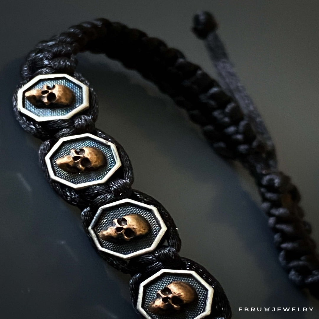 Edgy and stylish: Black Skull Men Woven Bracelet with intricate skull charms