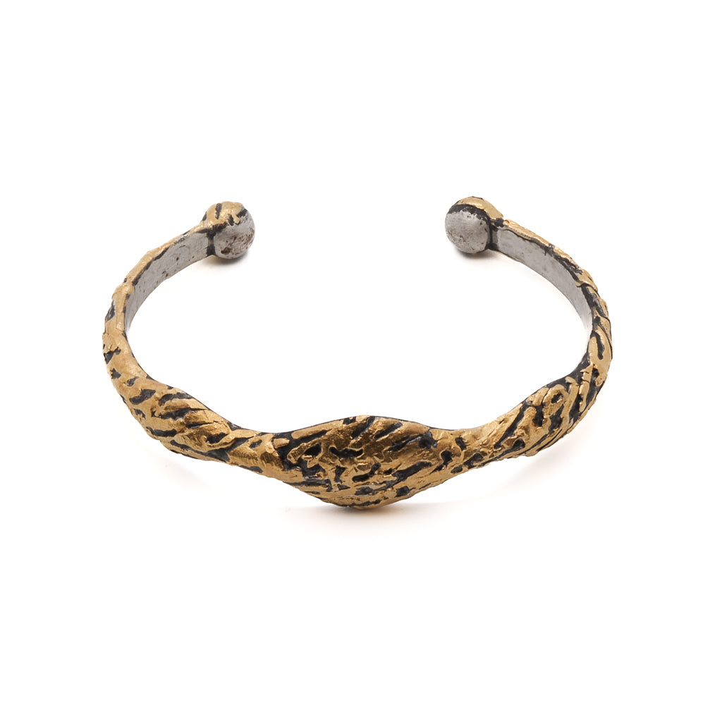 Nature Bangle Bracelet featuring a unique handmade design crafted from recycled metals and adorned with a 21k gold over silver surface.