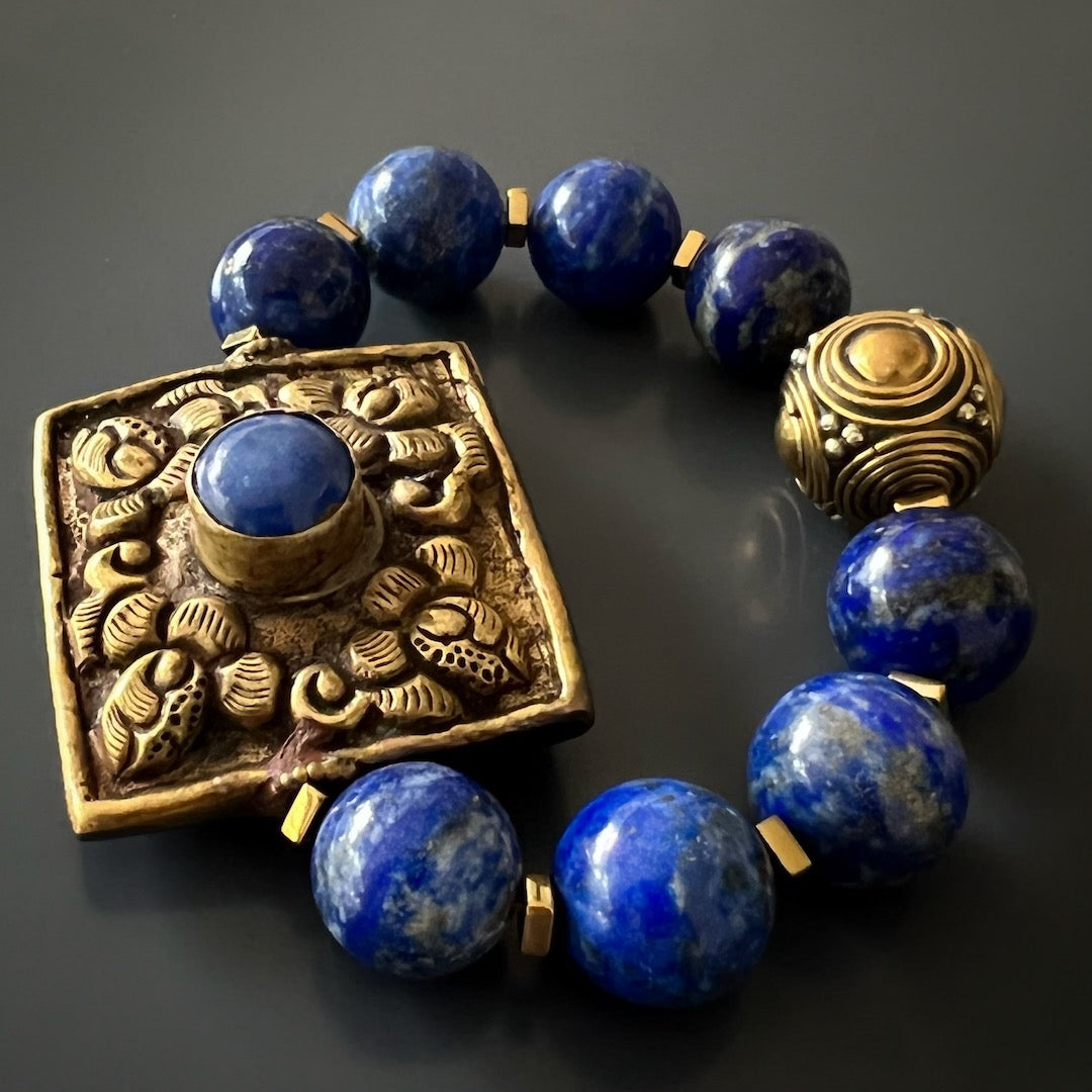 The Nepal Energy Bracelet draws attention with its stunning lapis lazuli beads and intricate brass piece from Nepal.