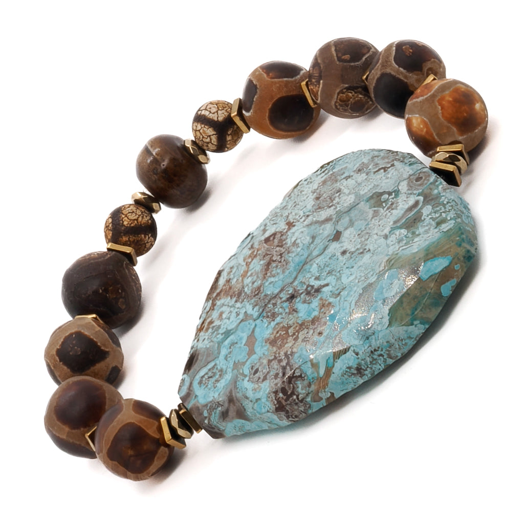 Explore the exquisite design of the Ocean Whisper Bracelet, combining Tibetan Agate beads with a captivating sky blue ocean jasper stone.