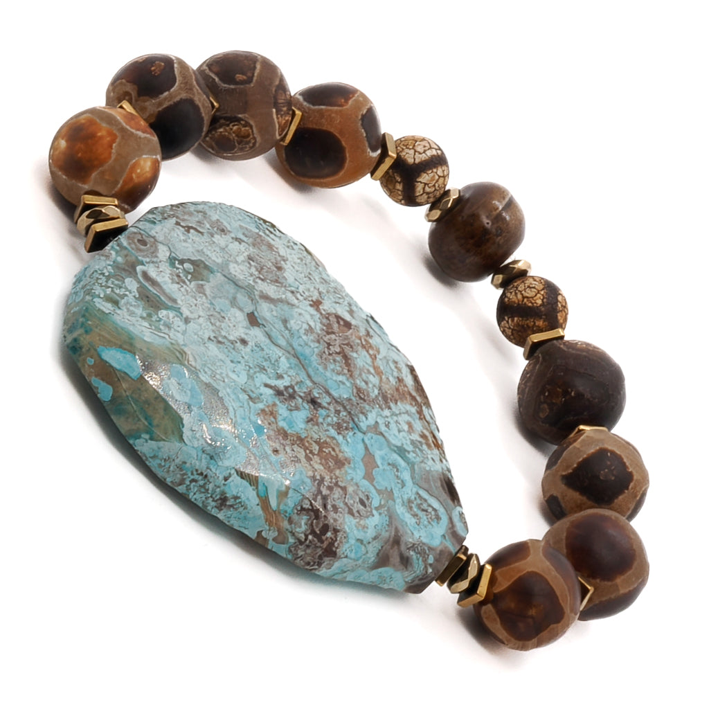 Embrace the bold and stylish design of the Ocean Whisper Bracelet, adorned with Tibetan Agate beads and a stunning ocean jasper stone.