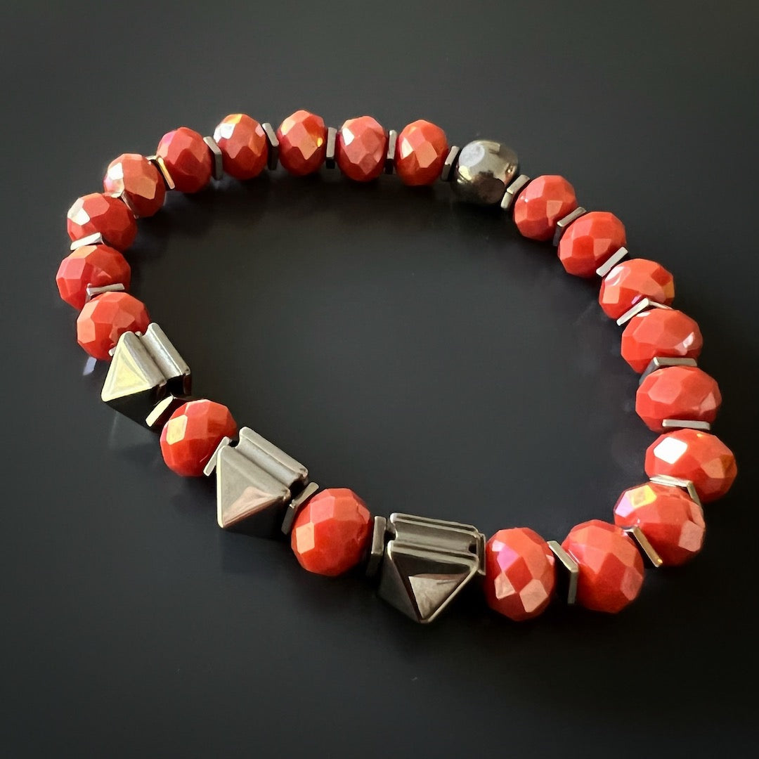 Enhance your energy and inspiration with the Orange Energy Bracelet, designed with orange crystal beads and silver hematite stone beads.