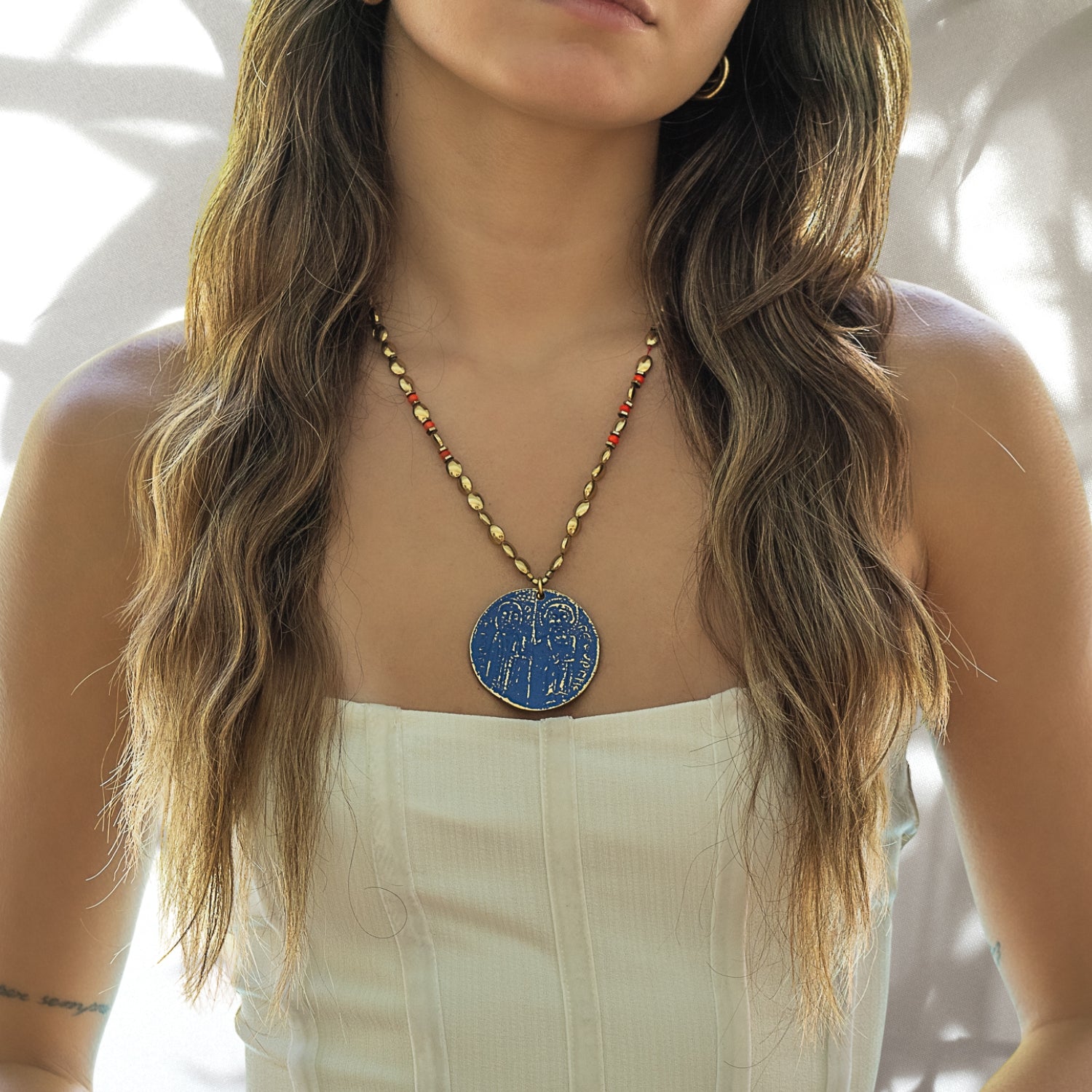 The Powerful Protection Talisman Necklace beautifully adorning the neck of the model