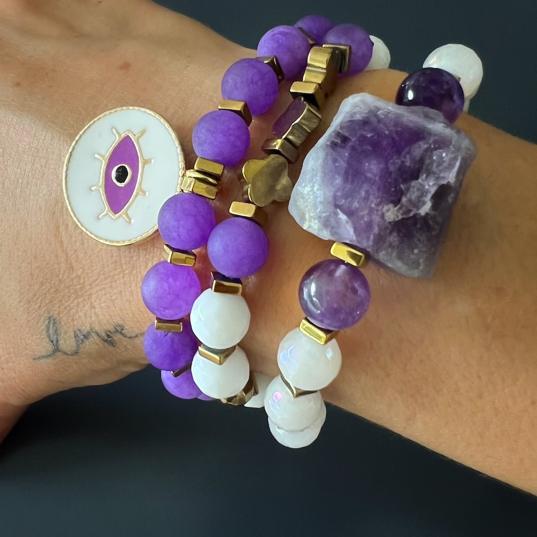 Experience the charm of the Purple Romantic Bracelet Set as the hand model wears it with grace and poise.
