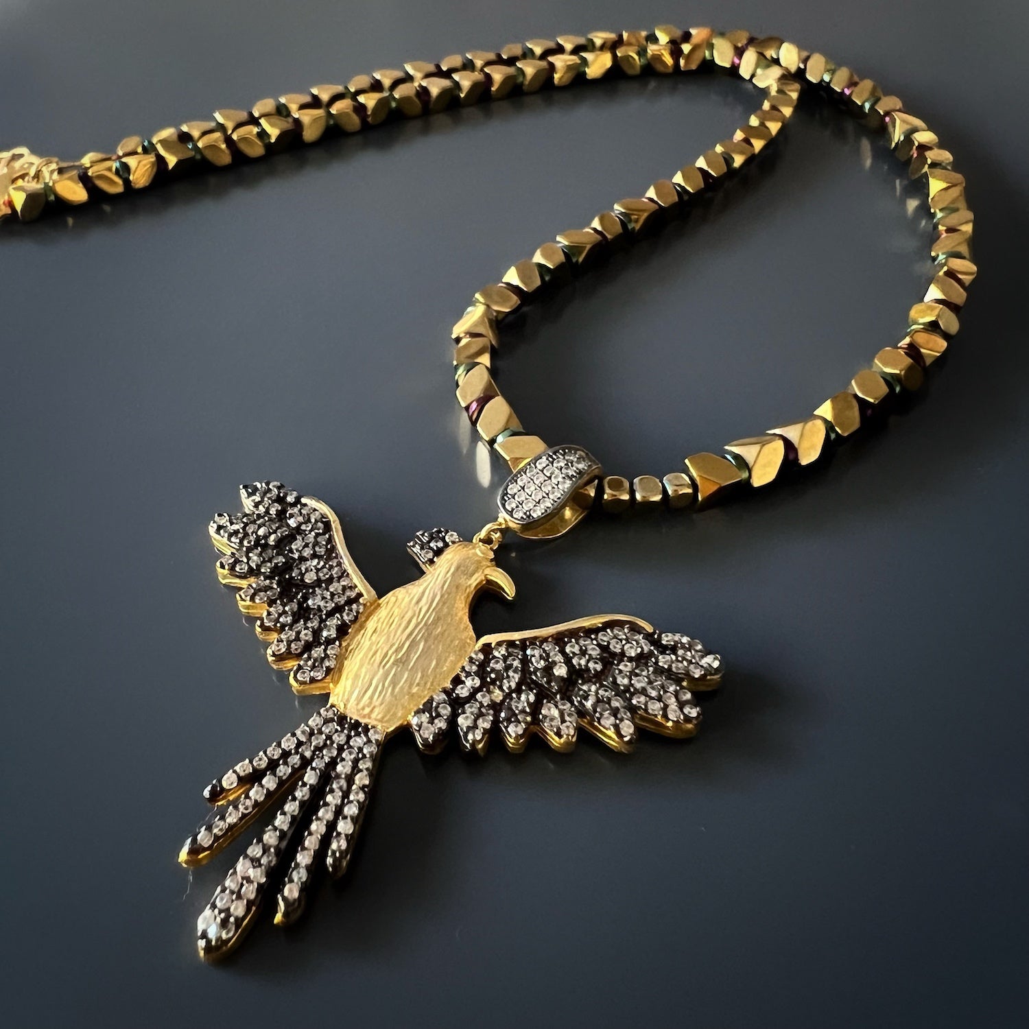 An elegant necklace with a Phoenix pendant, symbolizing everlasting beauty and transformation.