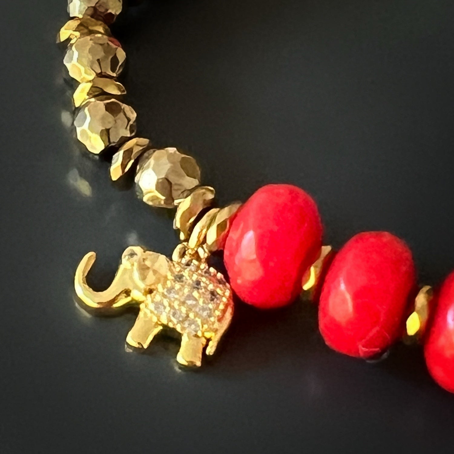 The Red Heart Lucky Elephant Bracelet is a beautiful representation of luck and elegance, with hematite stone beads and a gold-plated Elephant charm.
