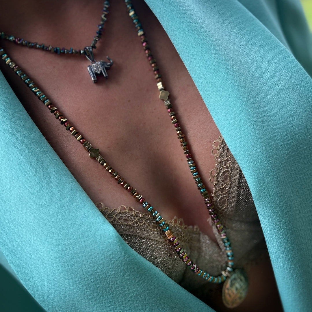 Embrace the Power of Shamanic Symbols - Our model showcases the Handmade Necklace.