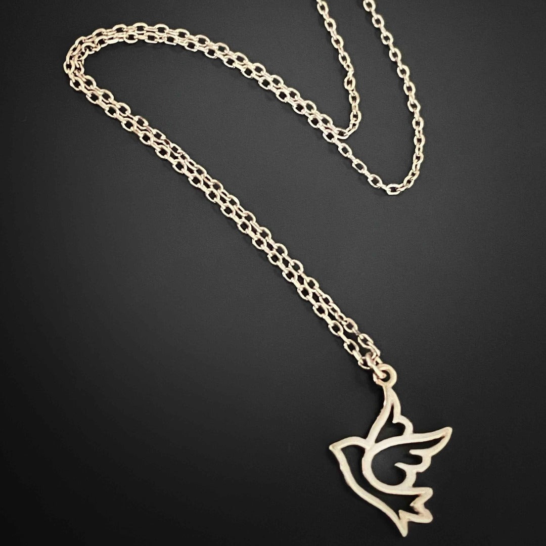 Admire the delicate beauty of the Silver Bird Necklace, featuring a dainty flying bird pendant on a sterling silver chain, symbolizing freedom and hope.