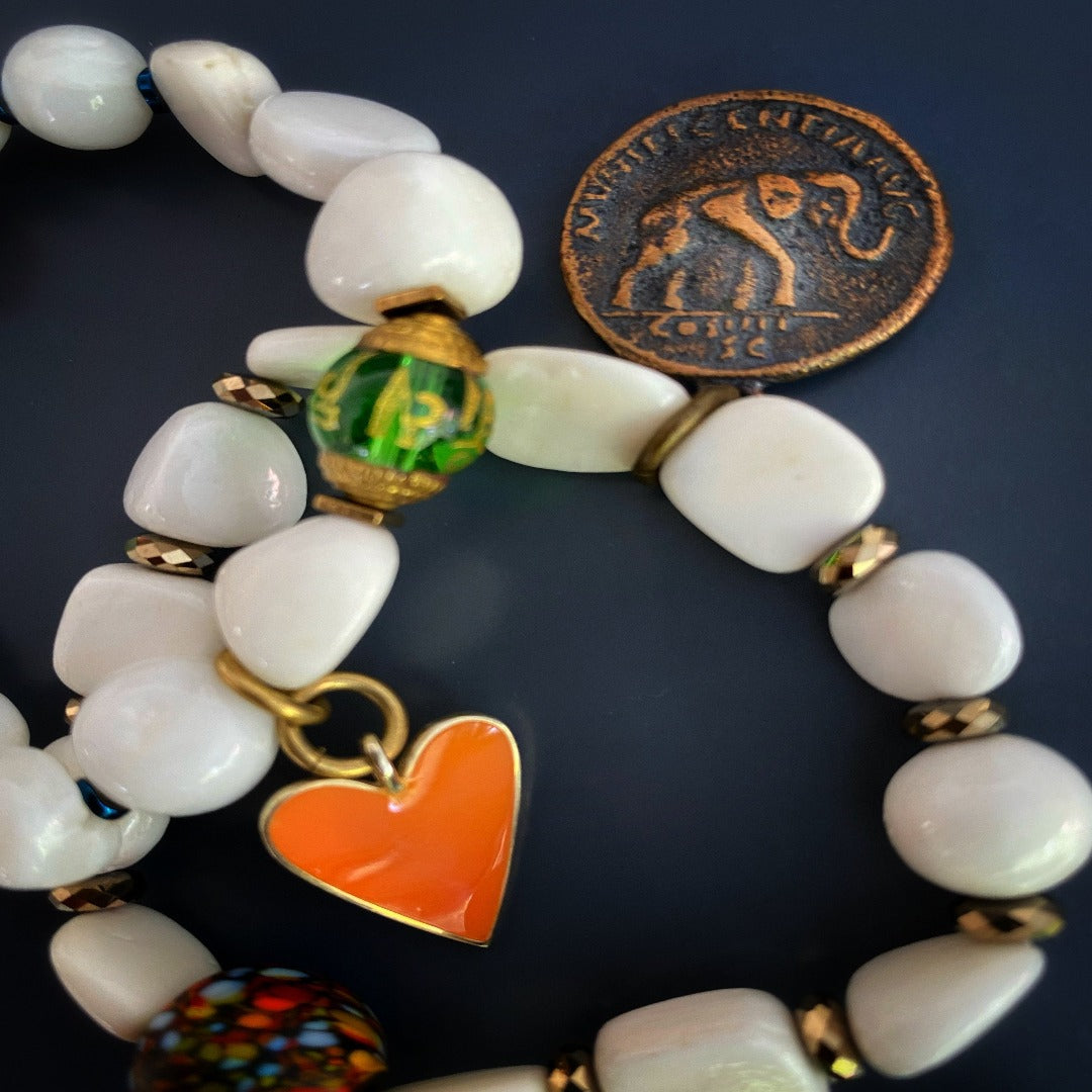 Immerse yourself in the Zen Bracelet Set, a unique accessory designed to promote peace and mindfulness with its Tibetan White Stone Beads and meaningful charms.
