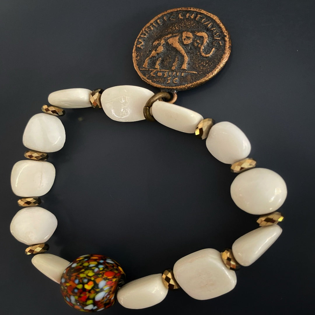 Experience the beauty of the Zen Bracelet Set, a handmade accessory that combines Tibetan White Stone Beads and meaningful charms to promote a sense of peace and intention.
