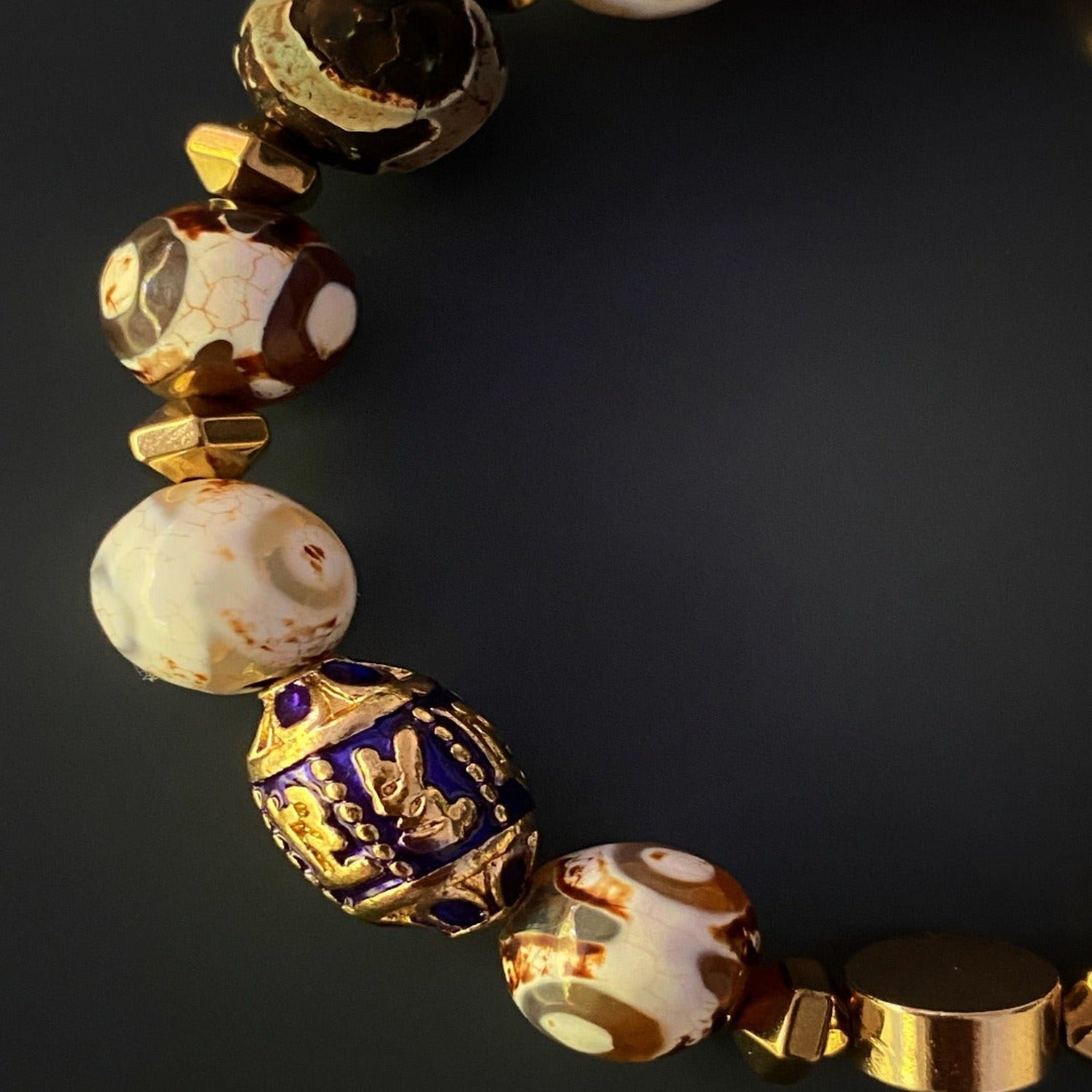 Elevate your style with the Lucky Fish Bracelet Set, beautifully crafted with Tibetan agate beads, gold hematite, and charms representing luck, wisdom, and prosperity.