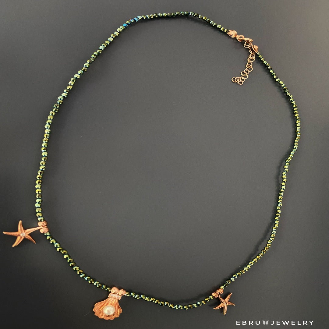 Add a pop of color and oceanic charm to any outfit with the Beach Day Necklace